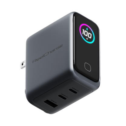 ReelCharge 3-in-1 100W laptop charger in gray with a round TFT display and three charging ports