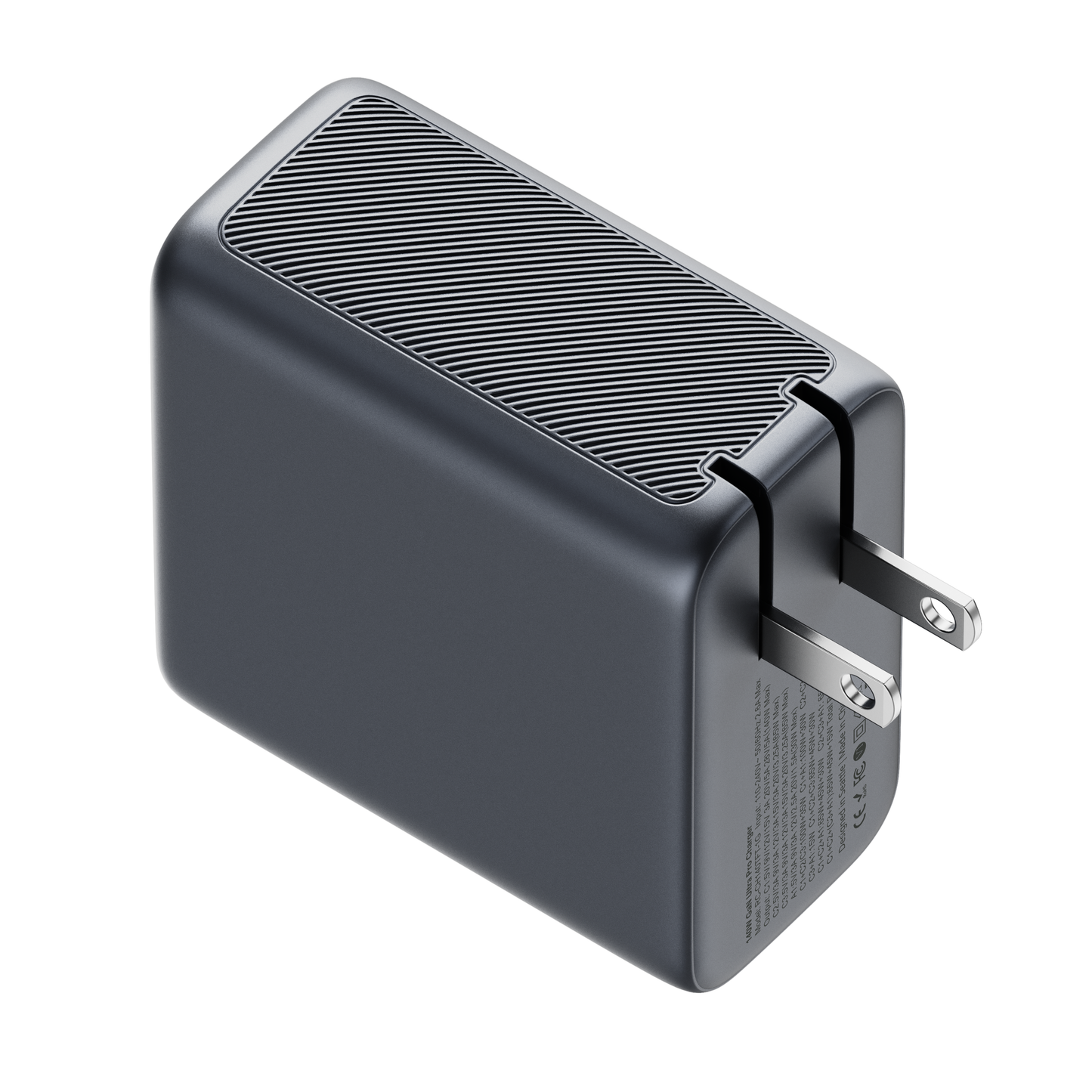 Top view of the ReelCharge 4-in-1 140W charger showing the ribbed housing and folding prongs