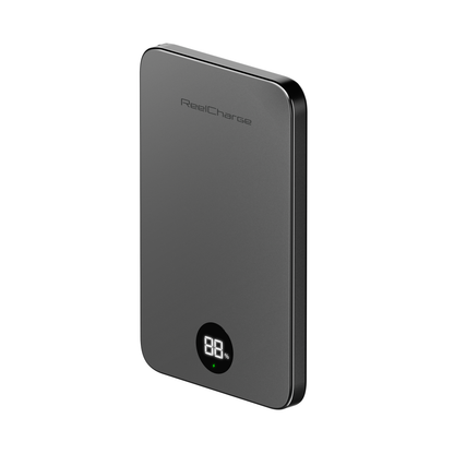 Angled view of the gray ReelSafe 5,000 mAh power bank with the LED battery display lit