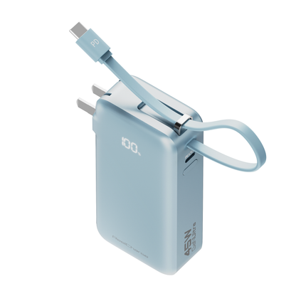ReelCharge Flex 10,000 mAh power bank in light blue with the integrated USB-C cable arched over the body and LED display lit