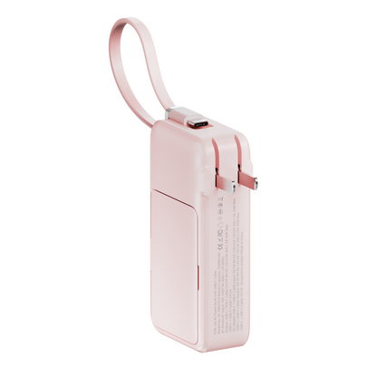 Side view of the pink ReFlextion 10,000 mAh power bank with its USB-C wristlet cable looped above the body