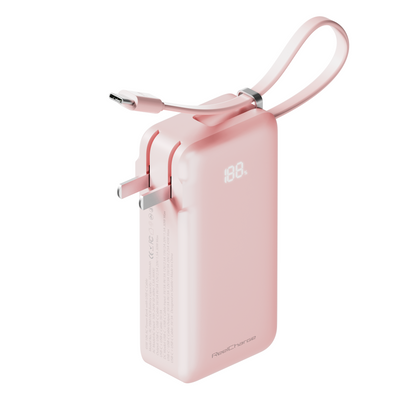 Pink ReFlextion power bank with the USB-C cable pulled out and the LED display showing battery percentage