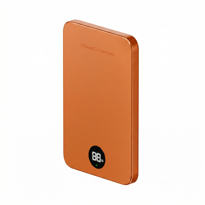 Angled view of the orange ReelSafe 5,000 mAh power bank with the LED display lit