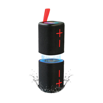 Black Mello Sync speaker split into its two magnetic halves with a water splash