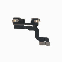 Back of the iPhone 14 Plus front camera module showing bracket and flex cable connectors