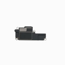 Reverse side of the iPhone 15 Pro loudspeaker assembly showing the black speaker housing
