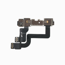 iPhone XR front camera flex assembly viewed from the back, showing metal shields and flex connectors