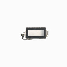 Reverse side of iPhone XS Max vibration motor showing flex connector and mounting bracket