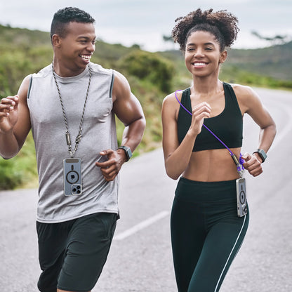 Two joggers wearing phones crossbody on PISEN braided lanyards while running outdoors