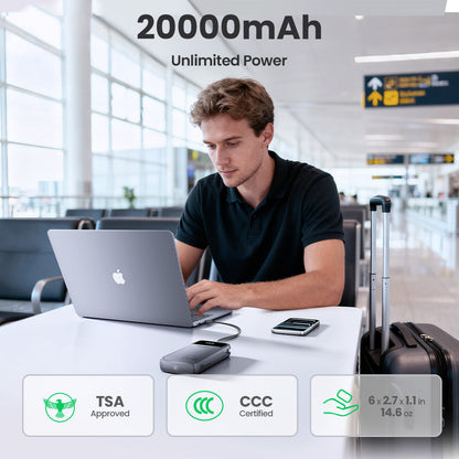 Traveler using the TSA-approved PISEN Bolt 67W 20000mAh power bank with a laptop at an airport