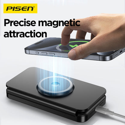 Hand snapping an iPhone onto the PISEN F6 travel charger, showing precise magnetic MagSafe attraction
