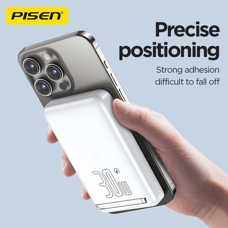 White PISEN MagiPi power bank magnetically attached to the back of an iPhone, held in hand